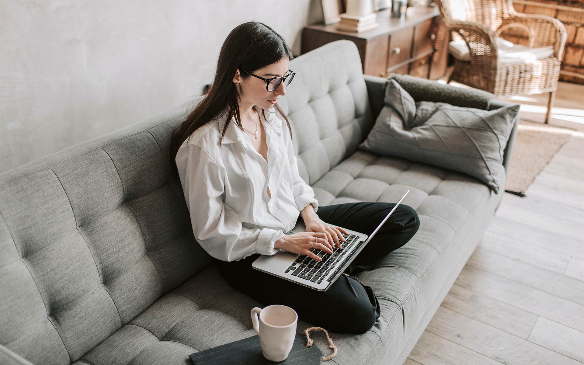 Woman Working on Couch